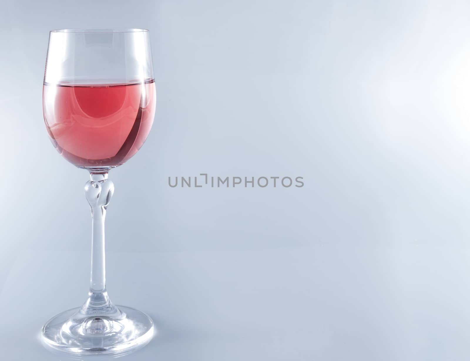 Isolated Pink wine in stemmed glasses on white background with copy space