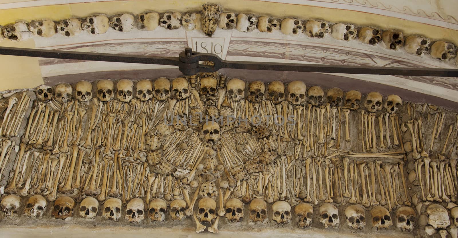 the  Capela dos Ossos  is one of the best known monuments in Évora, Portugal. It is a small interior chapel located next to the entrance of the Church of St. Francis