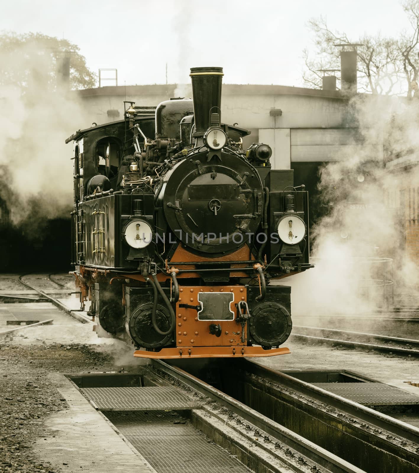 old black steam locomotive in germany by compuinfoto