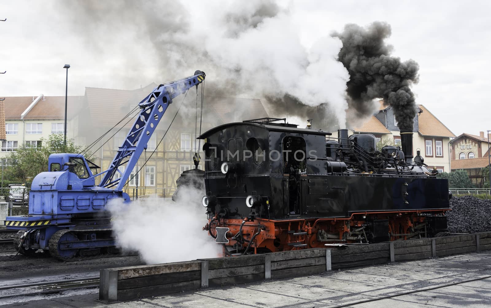 crane loading coal in steam locomotive in Wernigerode ,The trains to the Brocken mountain operate around the year for tourists.