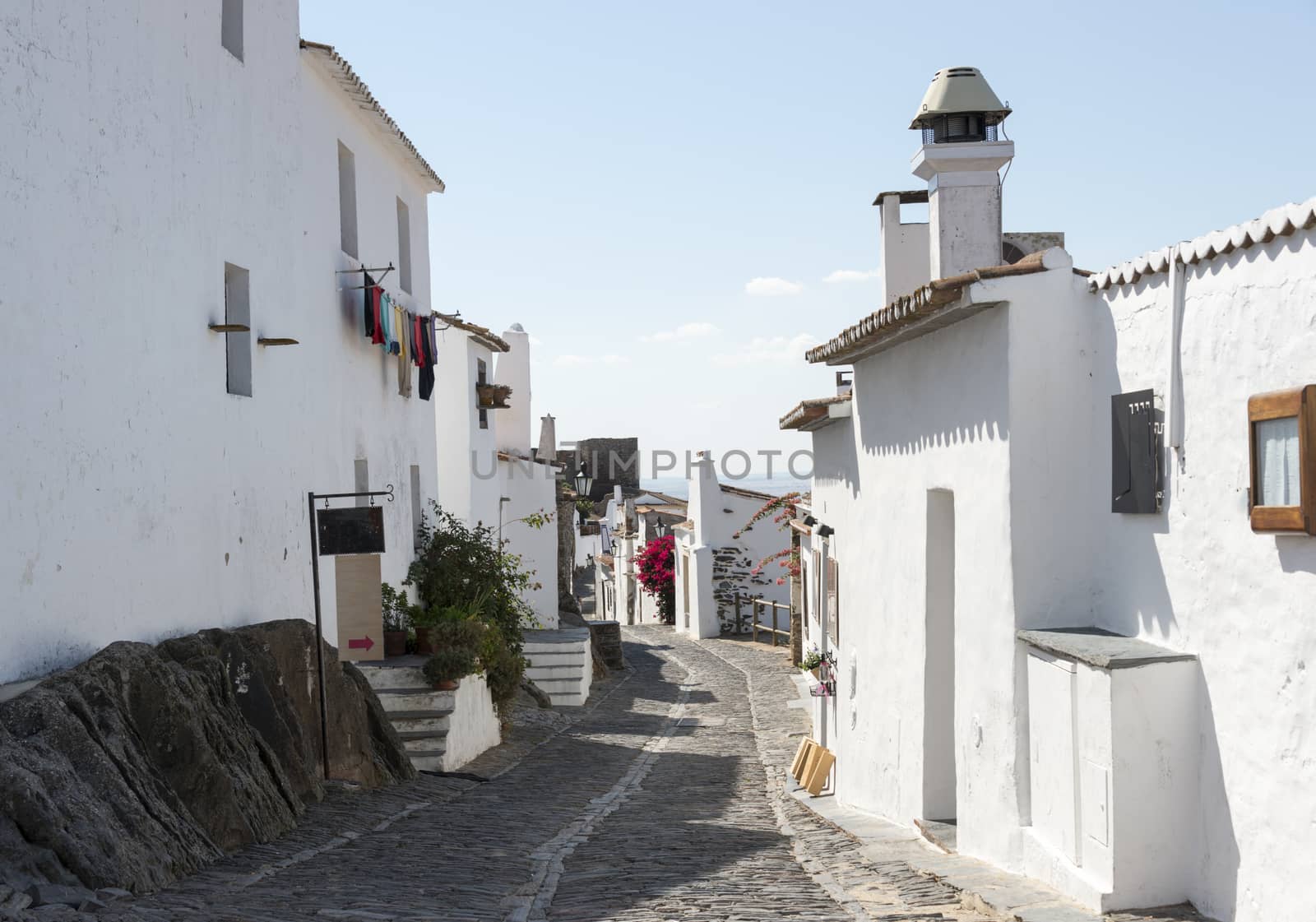 old mstreet with typical white houses in portugal alentejo village miradouro