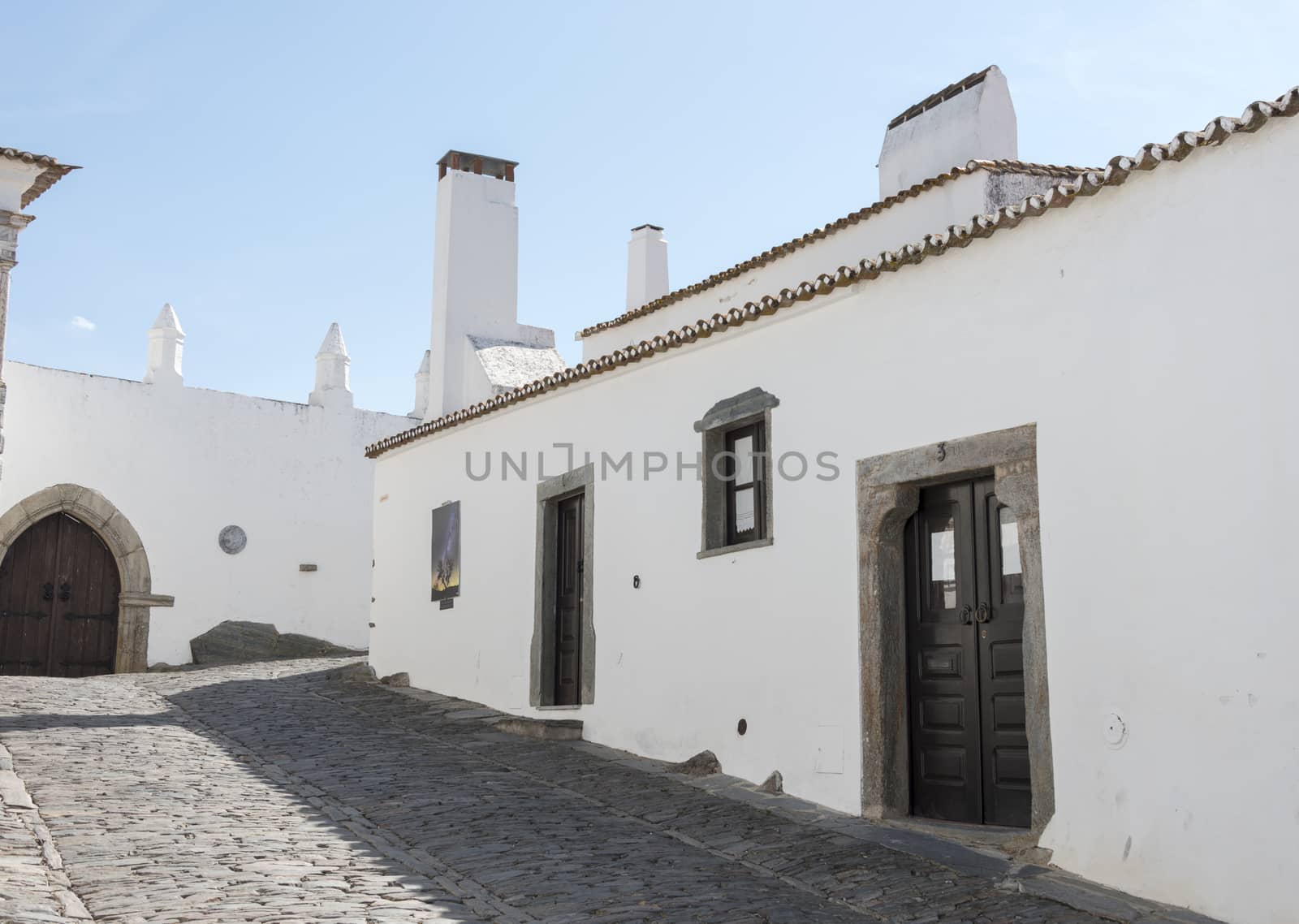 street with white houses monsaraz in alentejo portugal
