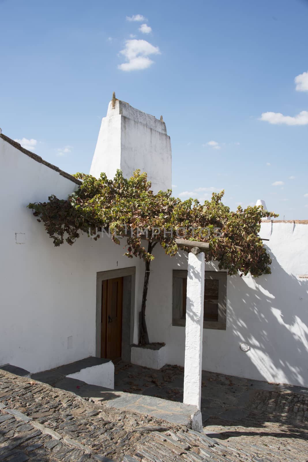 street with white houses monsaraz in alentejo portugal