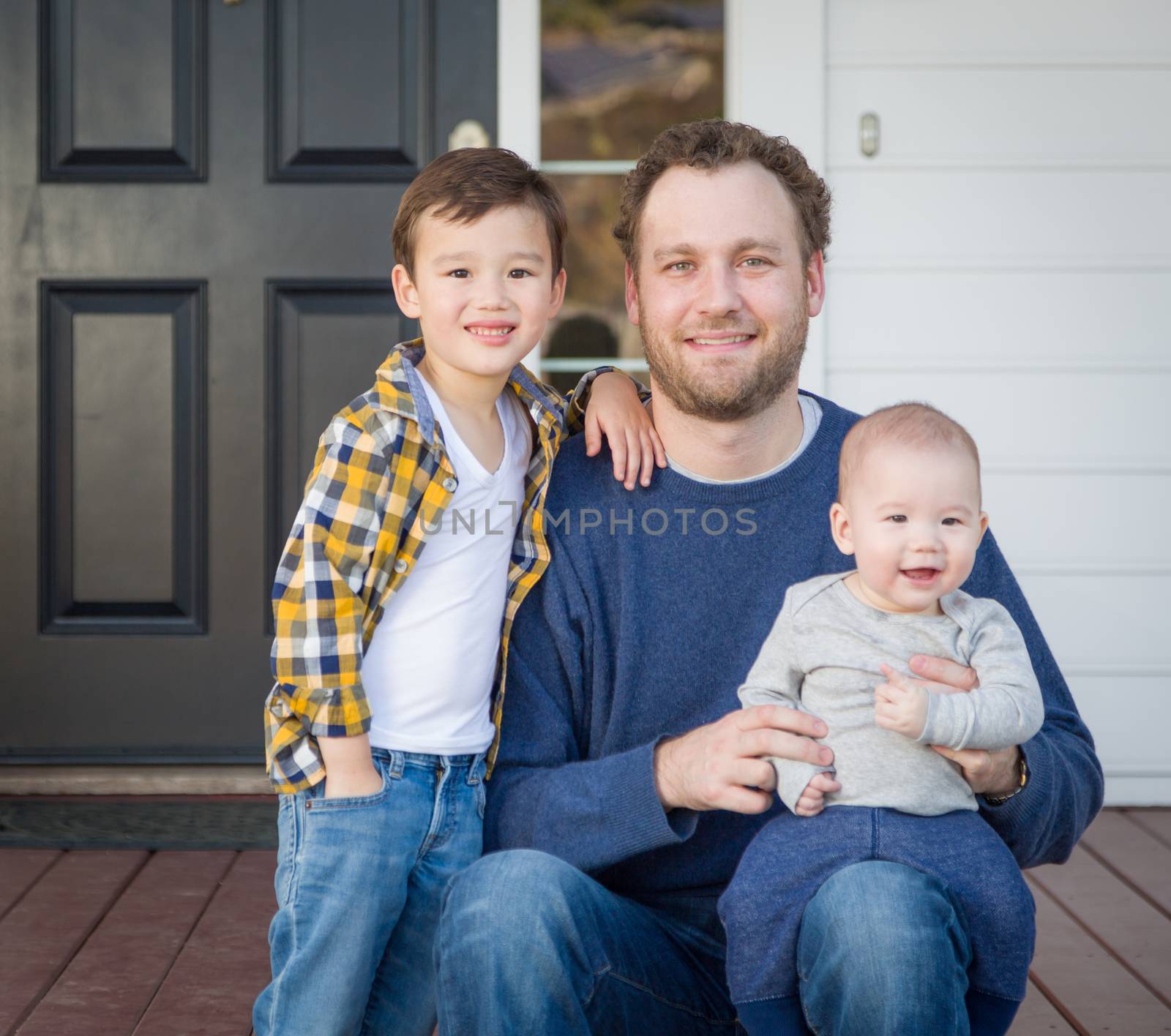 Mixed Race Father and Sons on Front Porch by Feverpitched