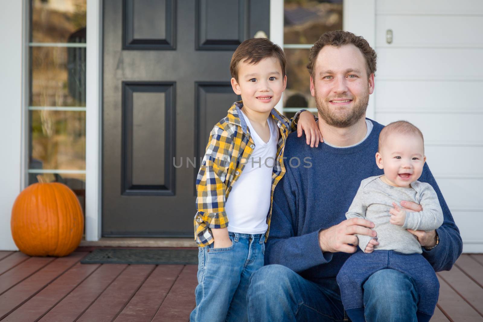 Mixed Race Father and Sons on Front Porch by Feverpitched