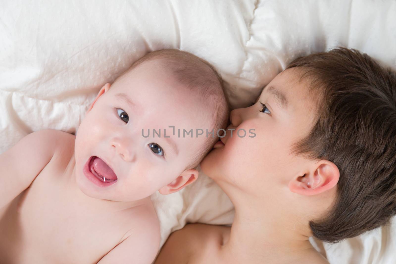 Mixed Race Chinese and Caucasian Baby Brothers Having Fun Laying by Feverpitched