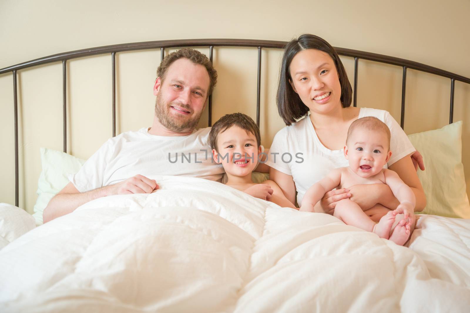 Mixed Race Chinese and Caucasian Baby Boys Laying In Bed with Th by Feverpitched