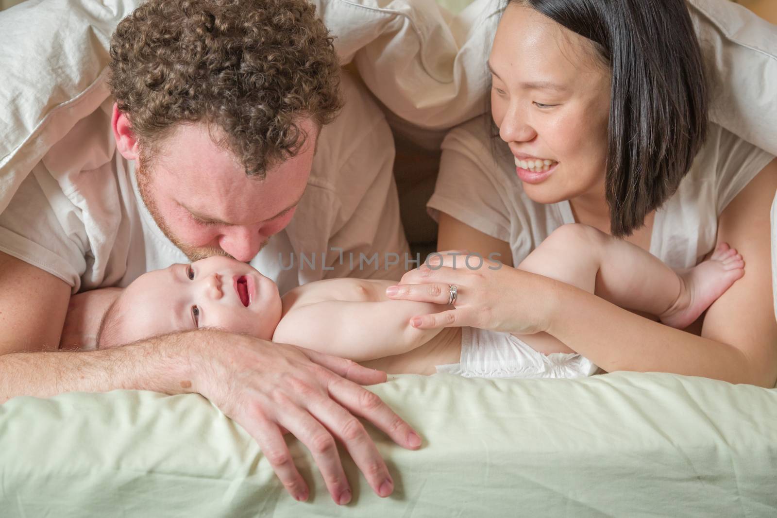 Mixed Race Chinese and Caucasian Baby Boy Laying In Bed with His by Feverpitched