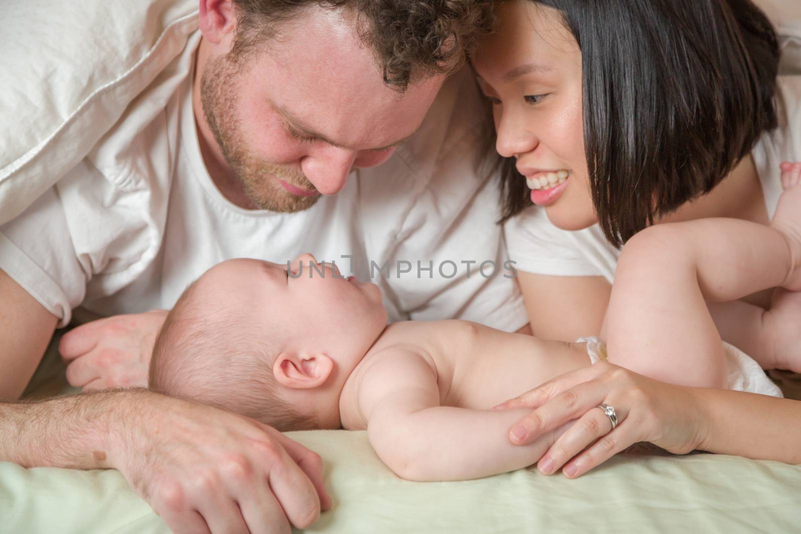 Mixed Race Chinese and Caucasian Baby Boy Laying In Bed with His by Feverpitched