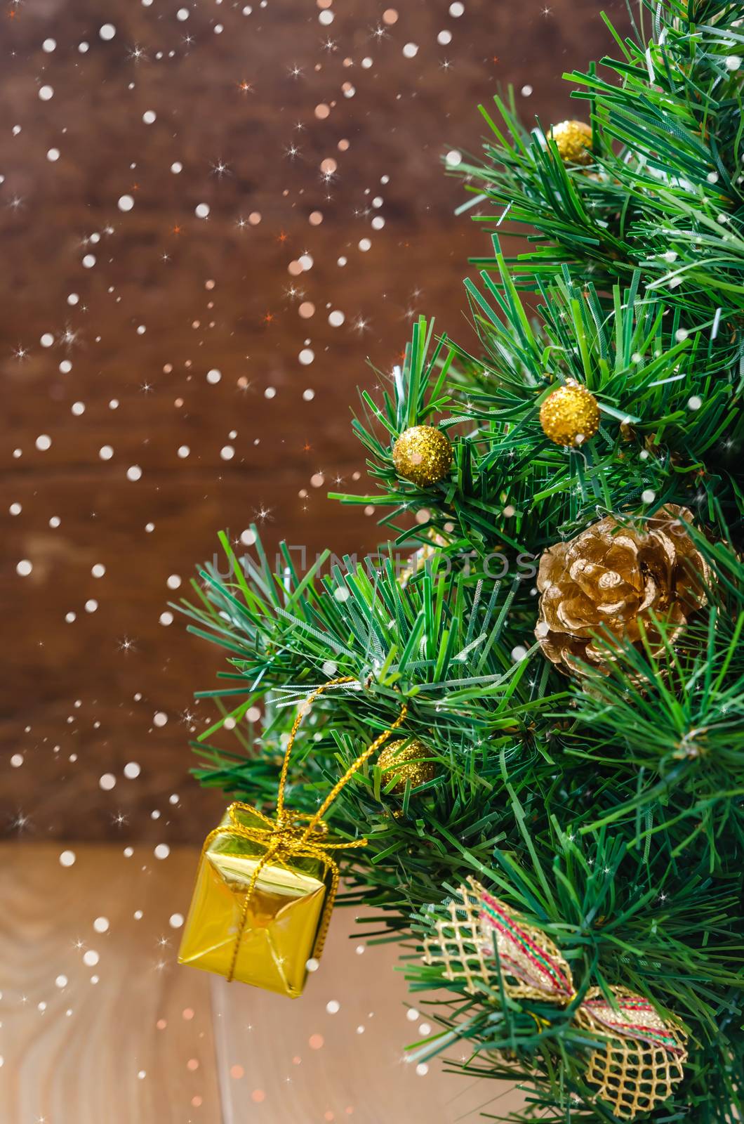 Christmas background with decorations and gift boxes on wooden board