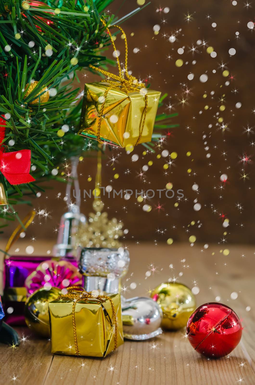 Christmas background with decorations and gift boxes on wooden board