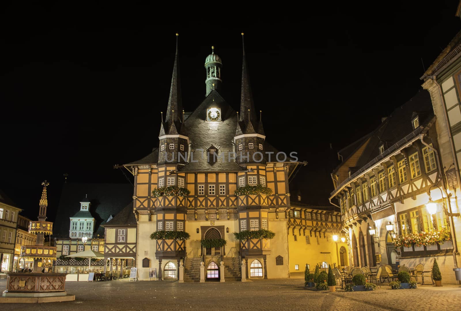 illuminated town hall in the centre of wernigerode by night, it is half timbered building style