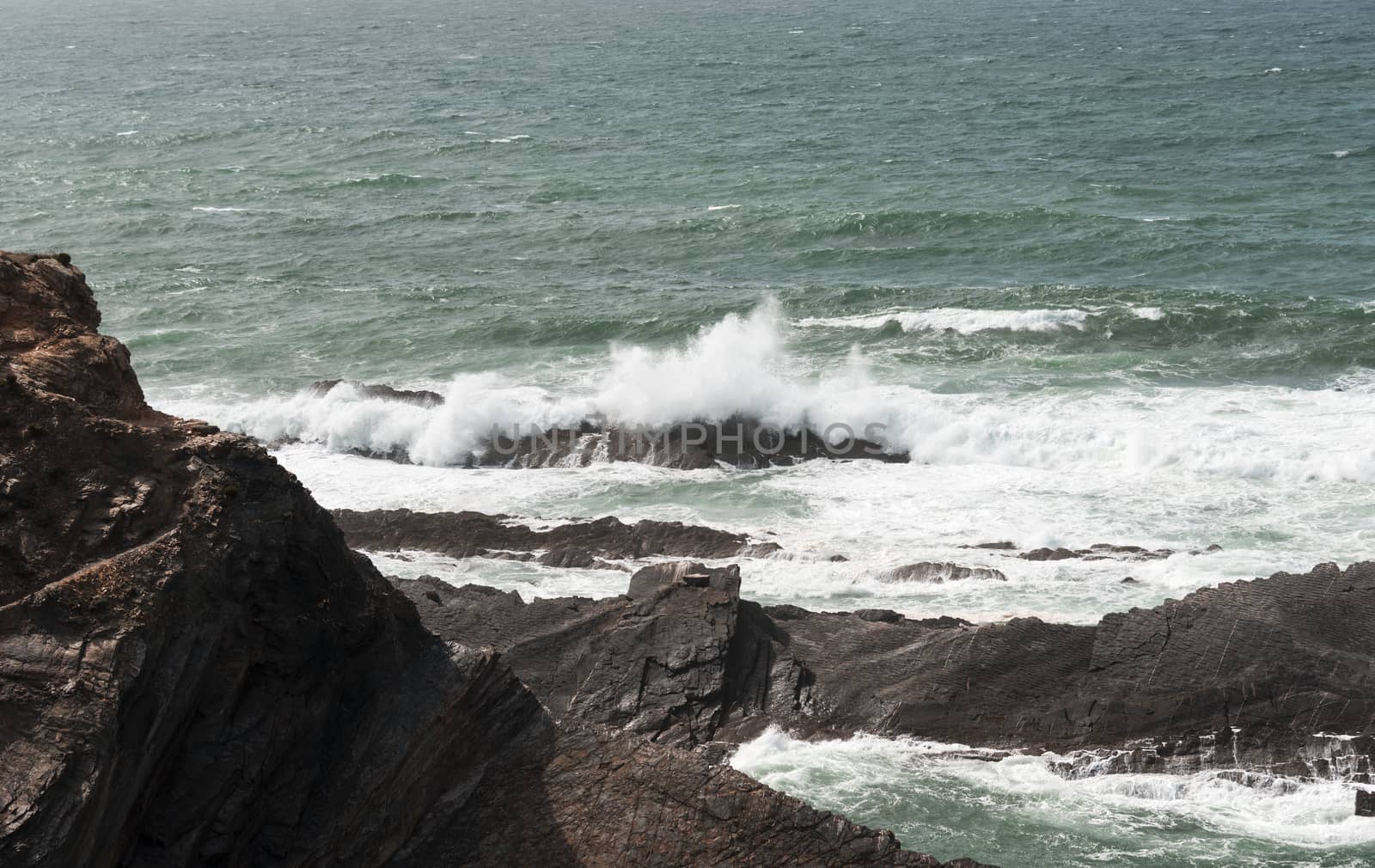 water splashing on the rocks at the atlantic ocean