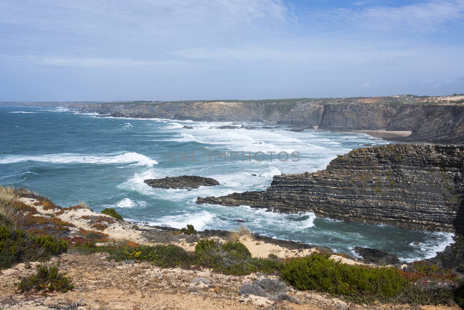 wild ocean splash water to the rocks of the west coast of Portugal