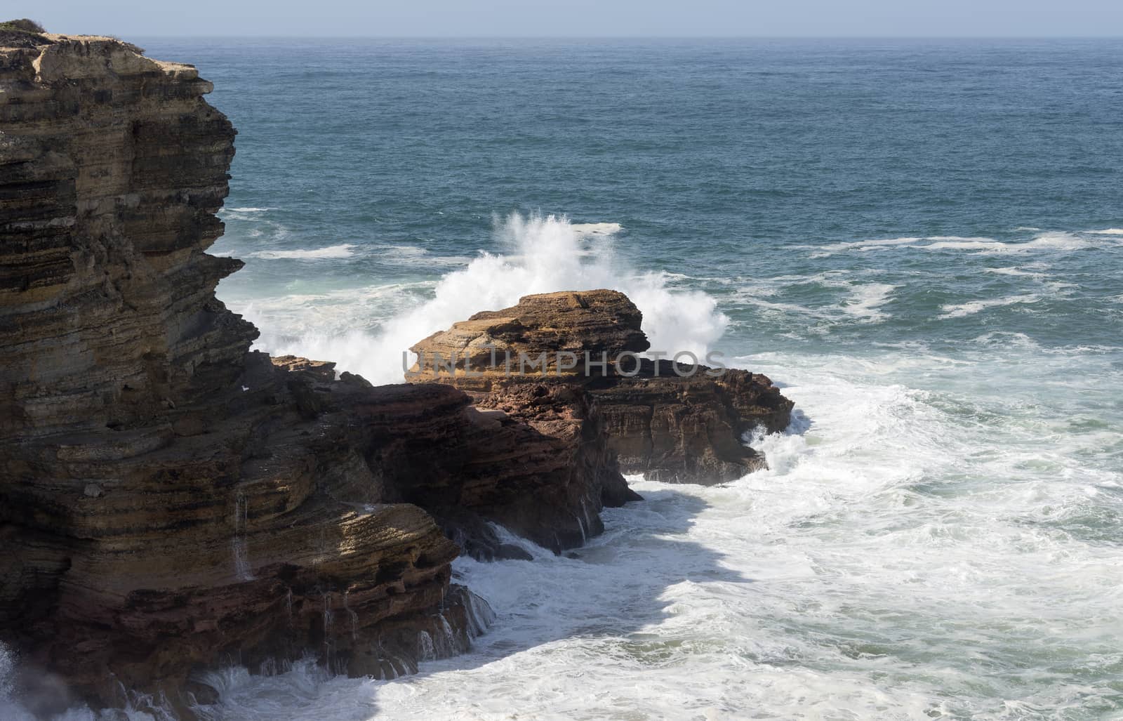 wild ocean splash water to the rocks of the west coast of Portugal