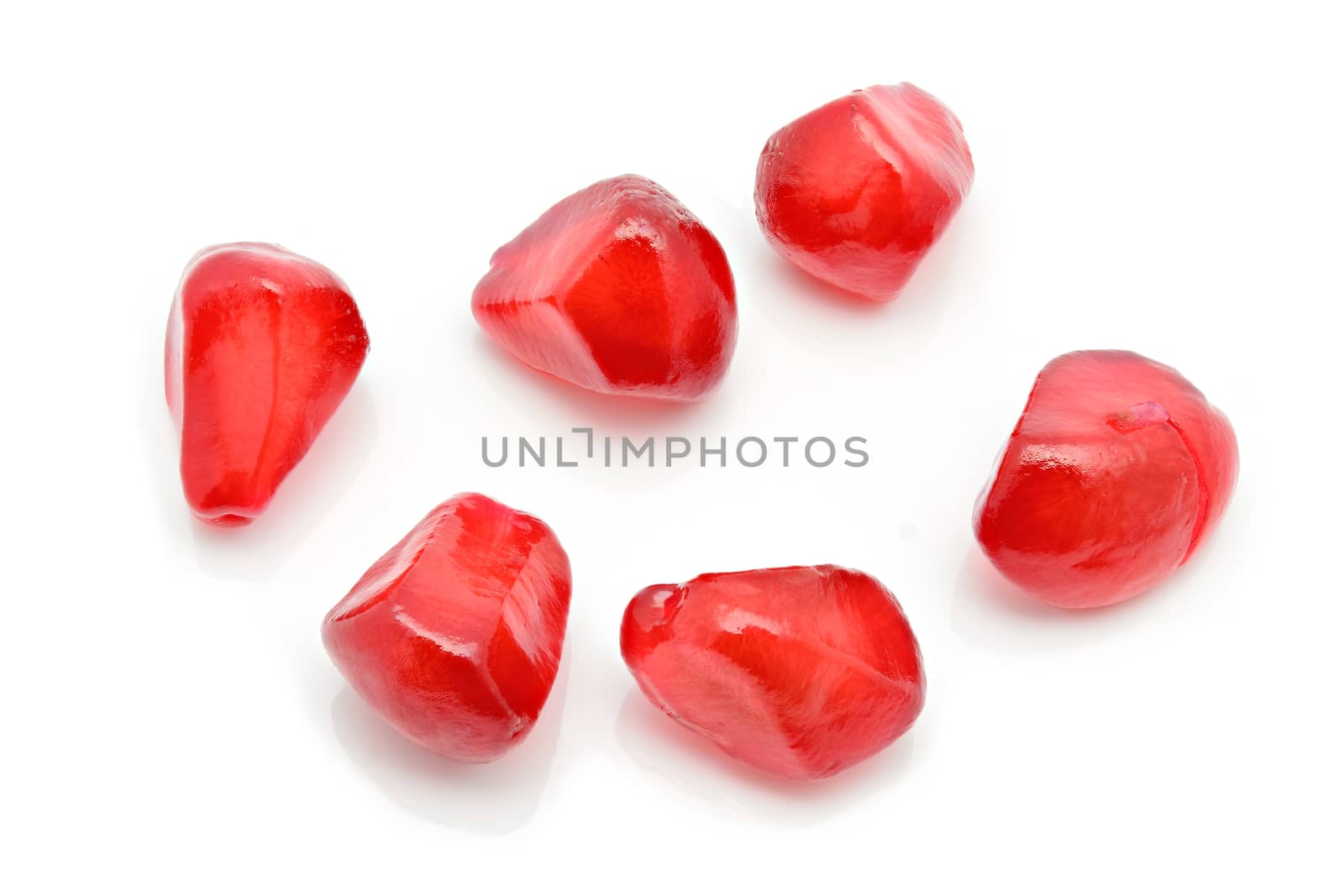 Closeup of pomegranate Seeds on a white background