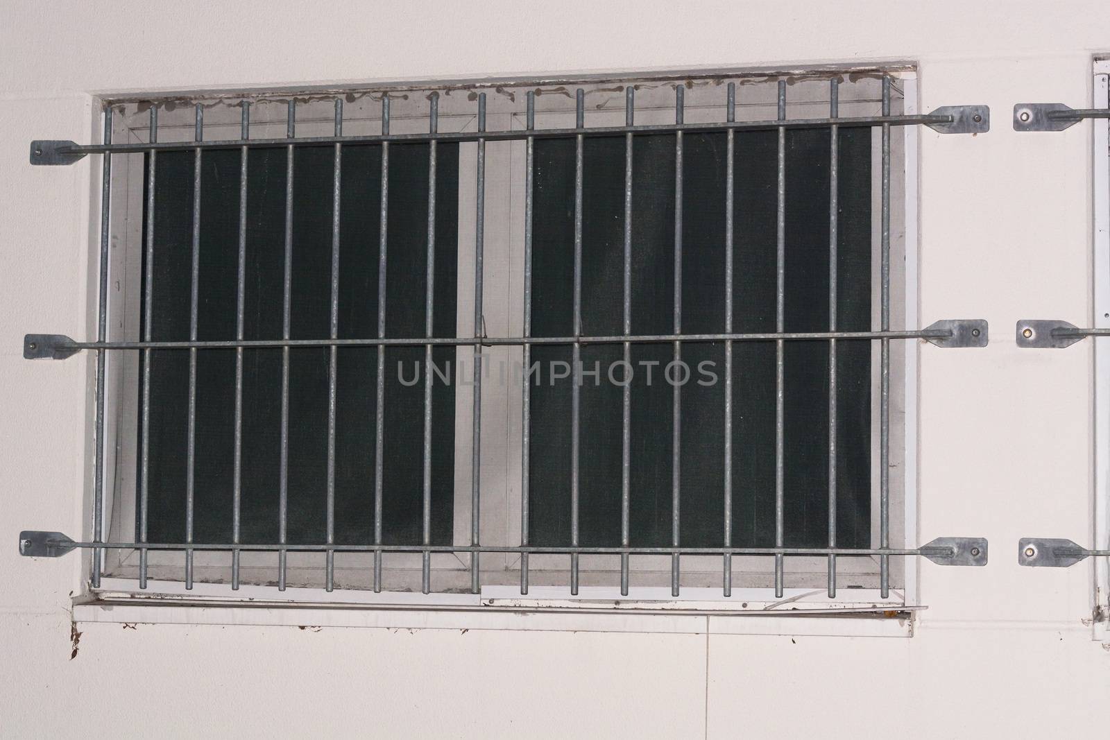 Installation of window grid of metal as protection against intruders. Security grille for windows, doors and balconies.
