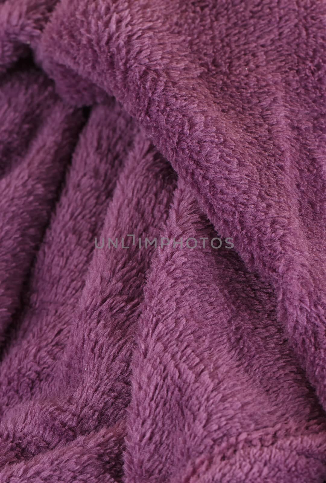 Dark purple bath fluffy towel or blanket