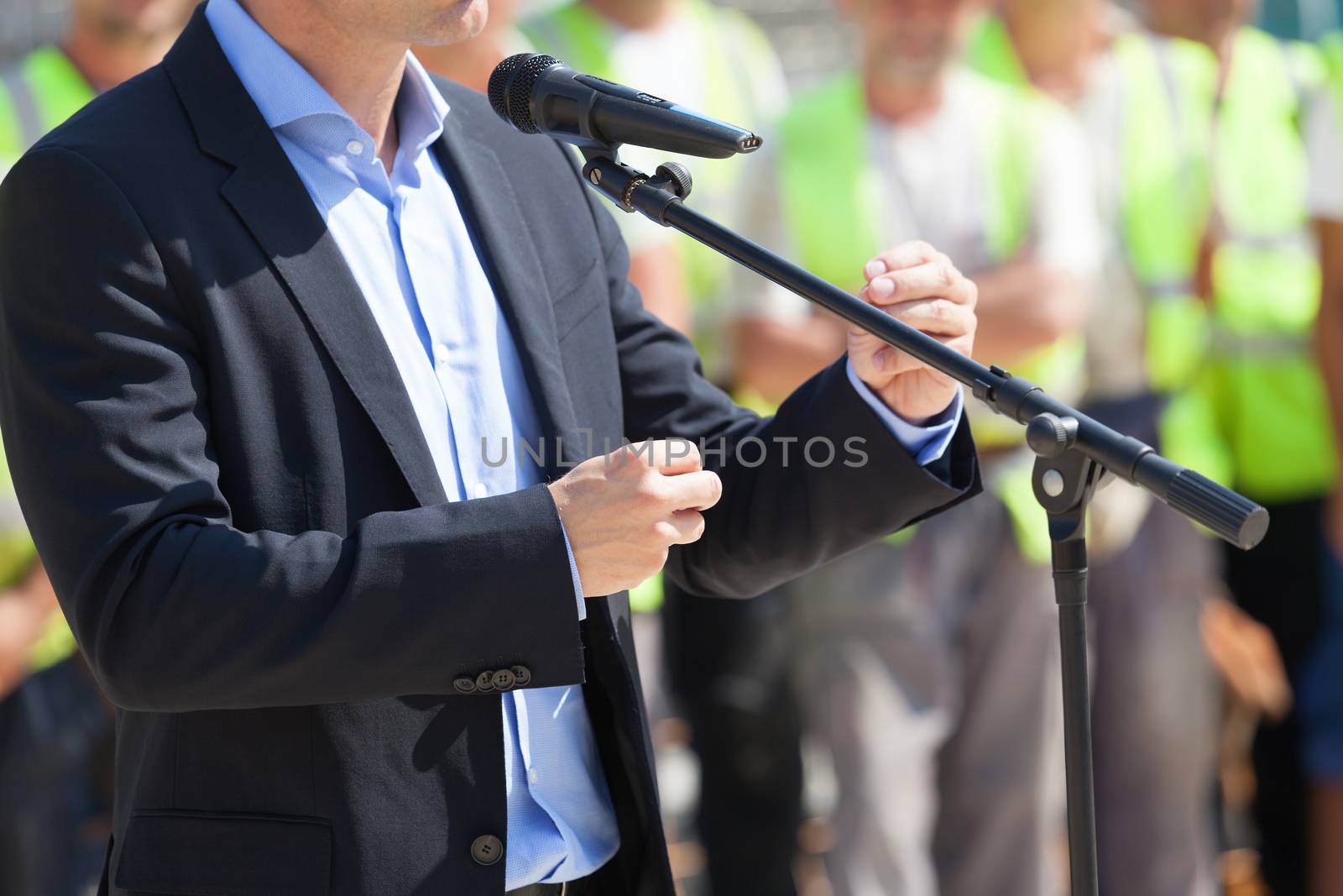  Businessman or politician is giving a speech by wellphoto