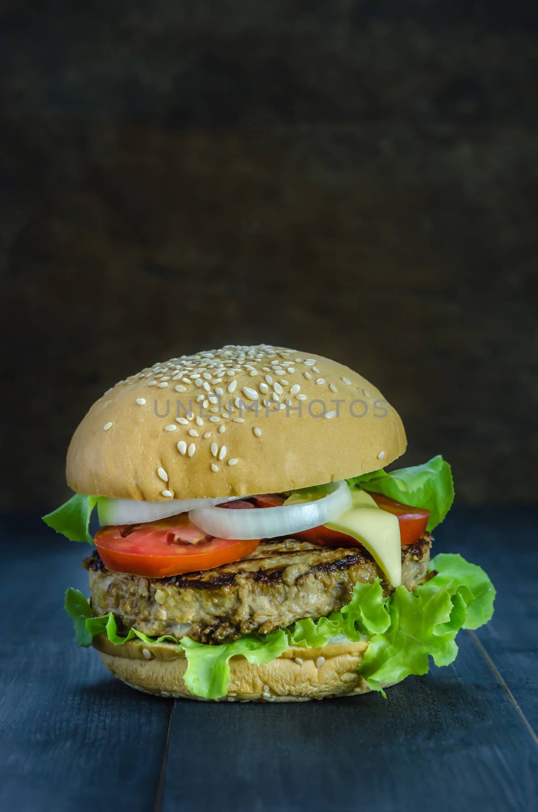 Closeup of home made burgers on wooden background