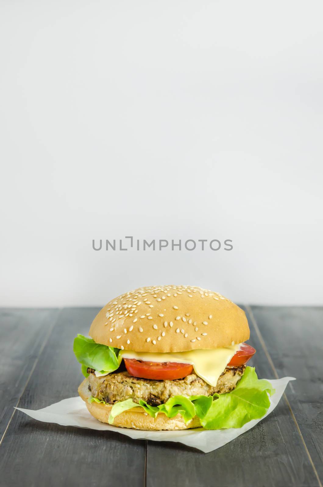 Closeup of home made burgers on wooden background