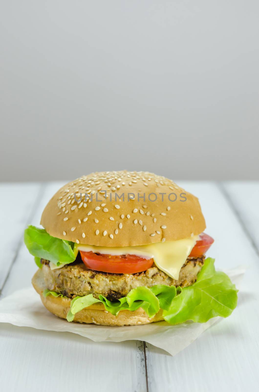 Closeup of home made burgers on wooden background