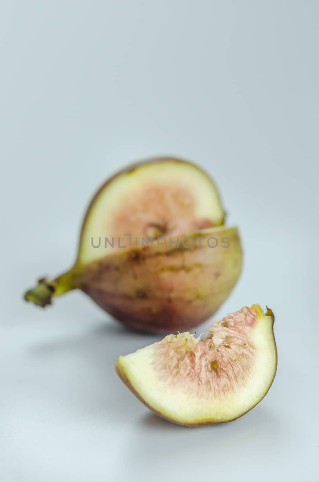 sliced fresh figs fruit on white background