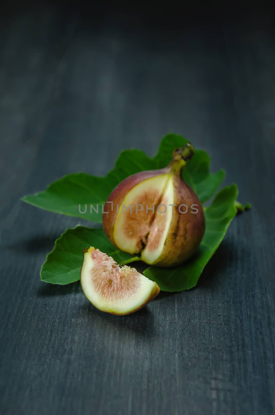 Portion of fresh Figs on wooden background