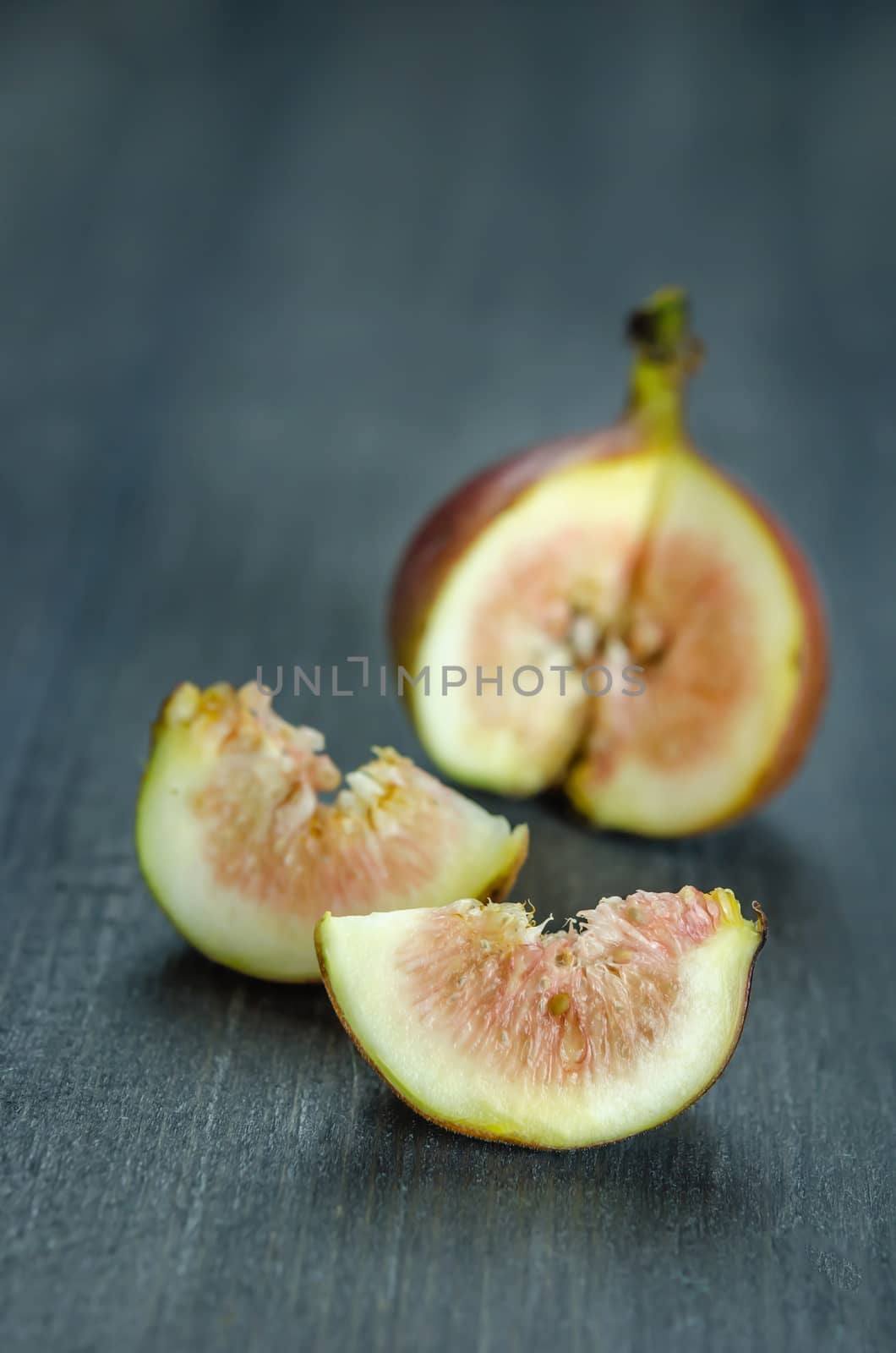 Portion of fresh Figs on wooden background