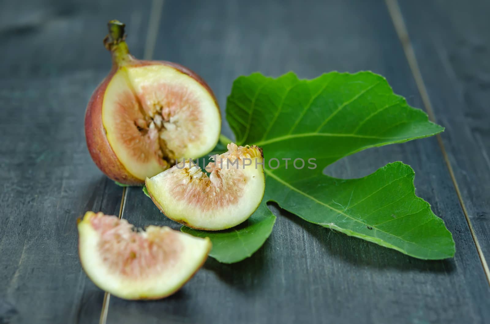 Portion of fresh Figs on wooden background