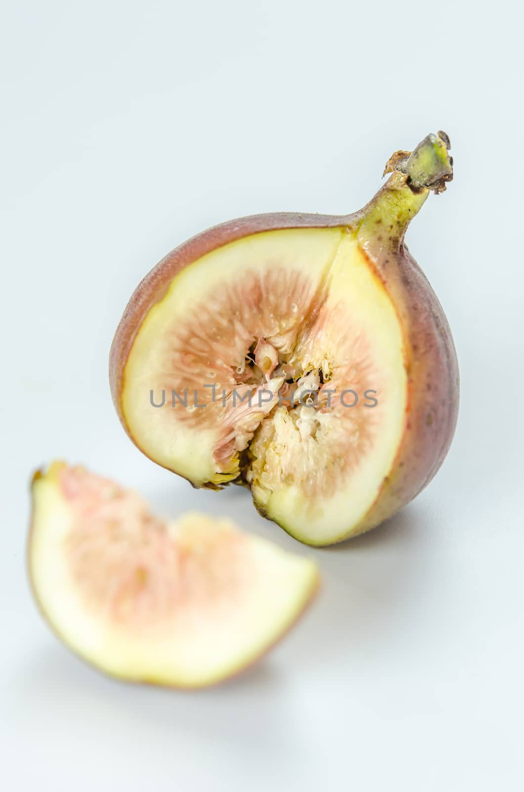 sliced fresh figs fruit on white background