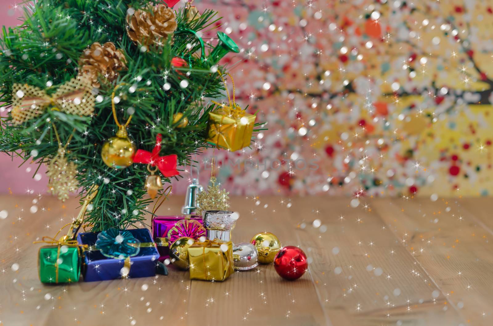 Christmas background with decorations and gift boxes on wooden board