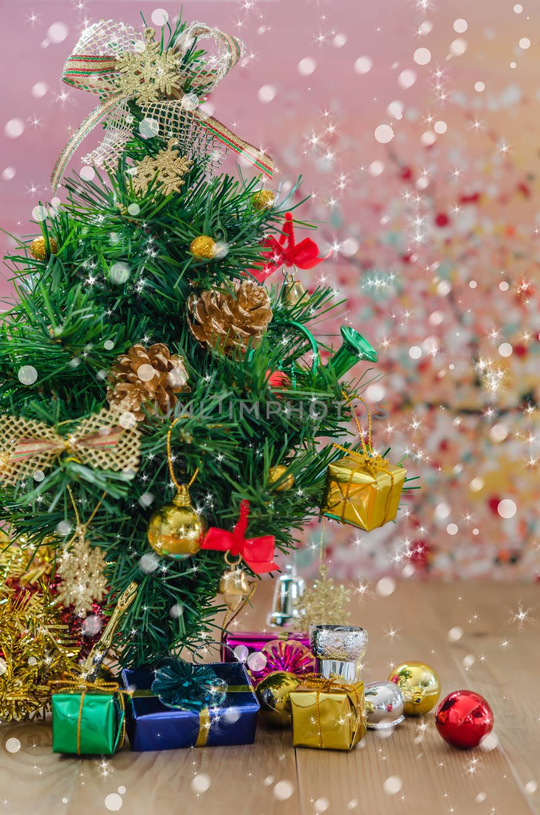 Christmas background with decorations and gift boxes on wooden board