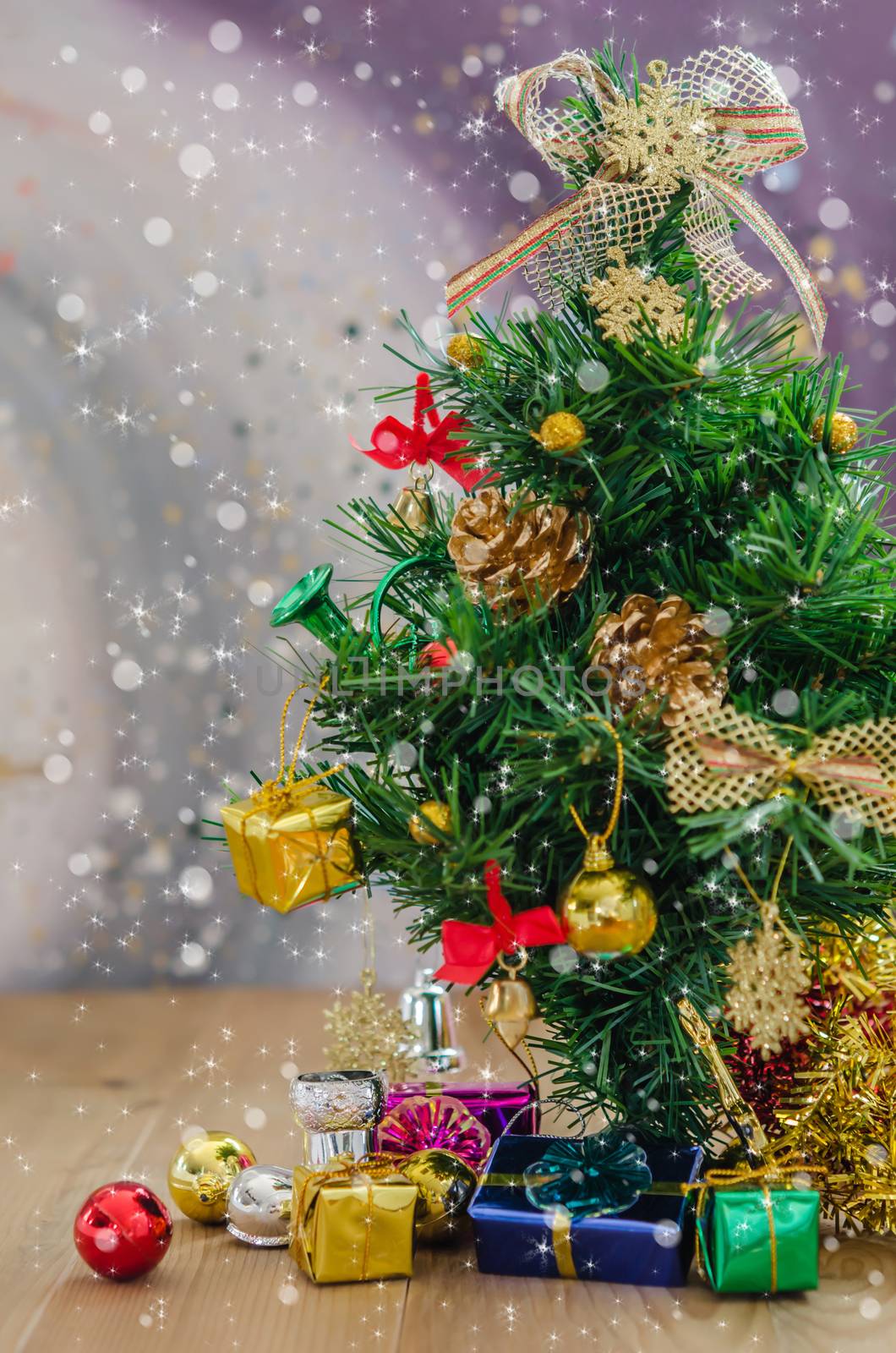 Christmas background with decorations and gift boxes on wooden board