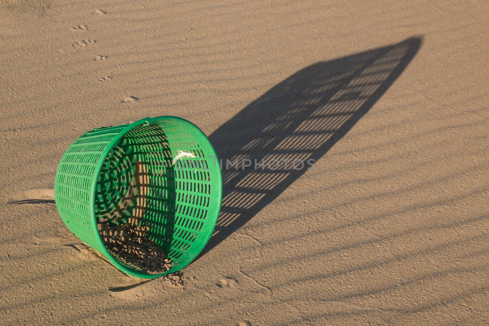 Washed-up basket on the beach by YassminPhoto