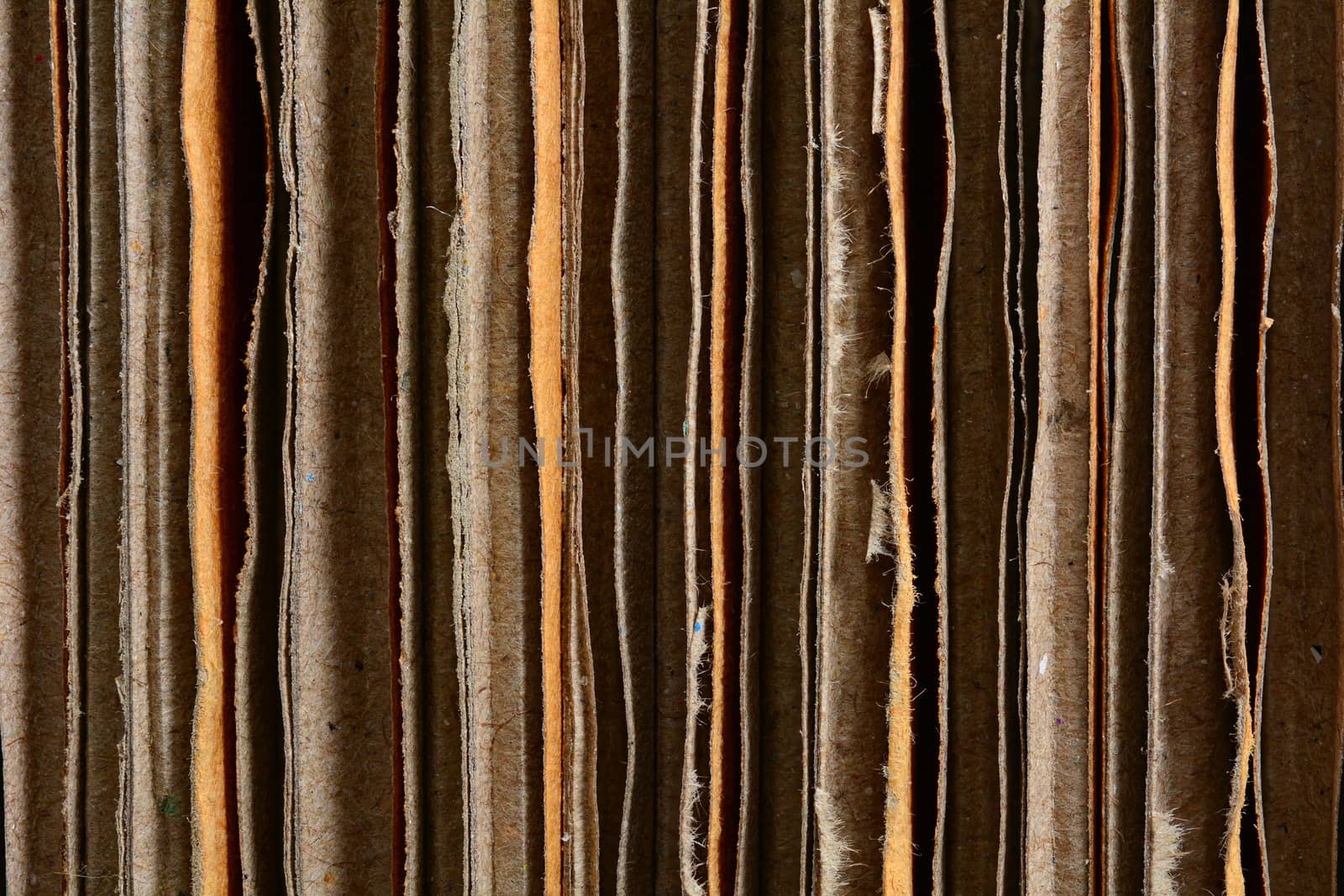 Closeup vertical side view of a stacked cardboard