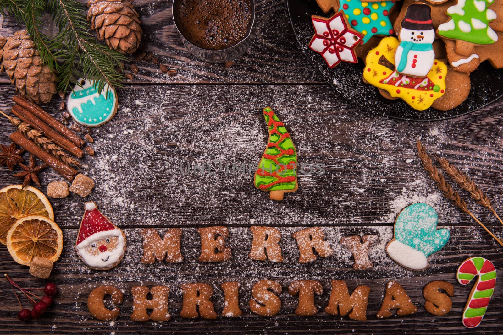 Gingerbreads and coffee for new years and christmas on wooden background, xmas theme