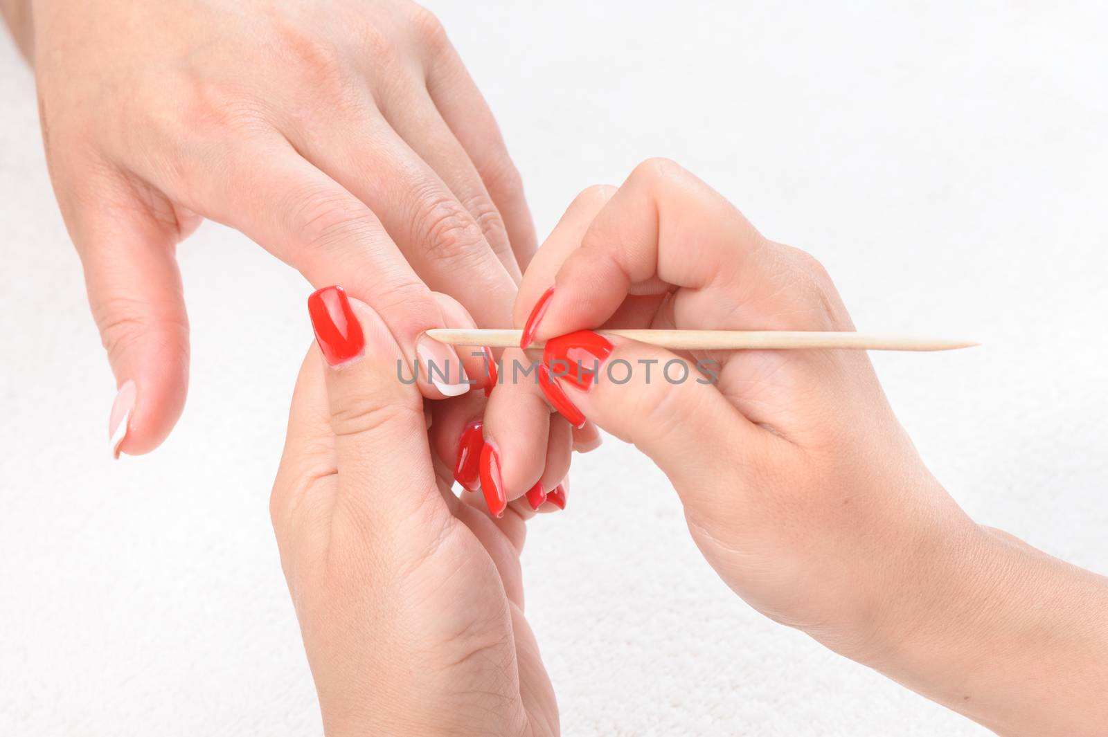 Nail salon, hands beauty treatment, cuticles care with cuticle pusher