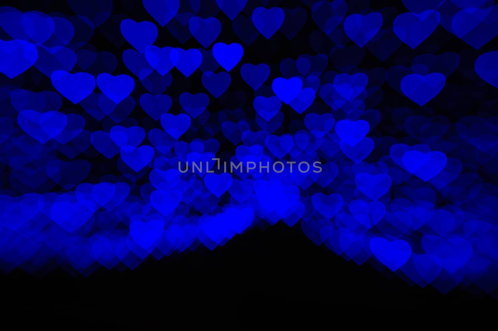 abstract black background with soft blue hearts.