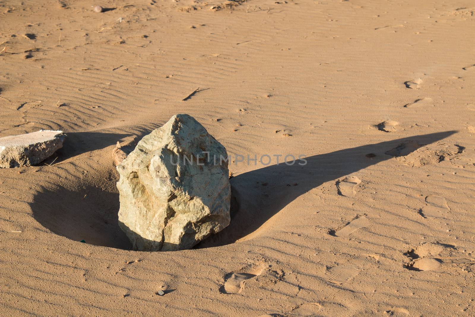 Big stone on a sandy beach by YassminPhoto