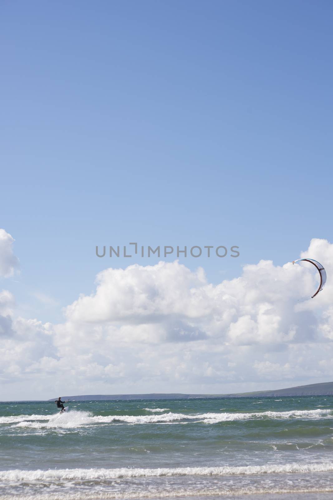 extreme kite surfer on waves by morrbyte