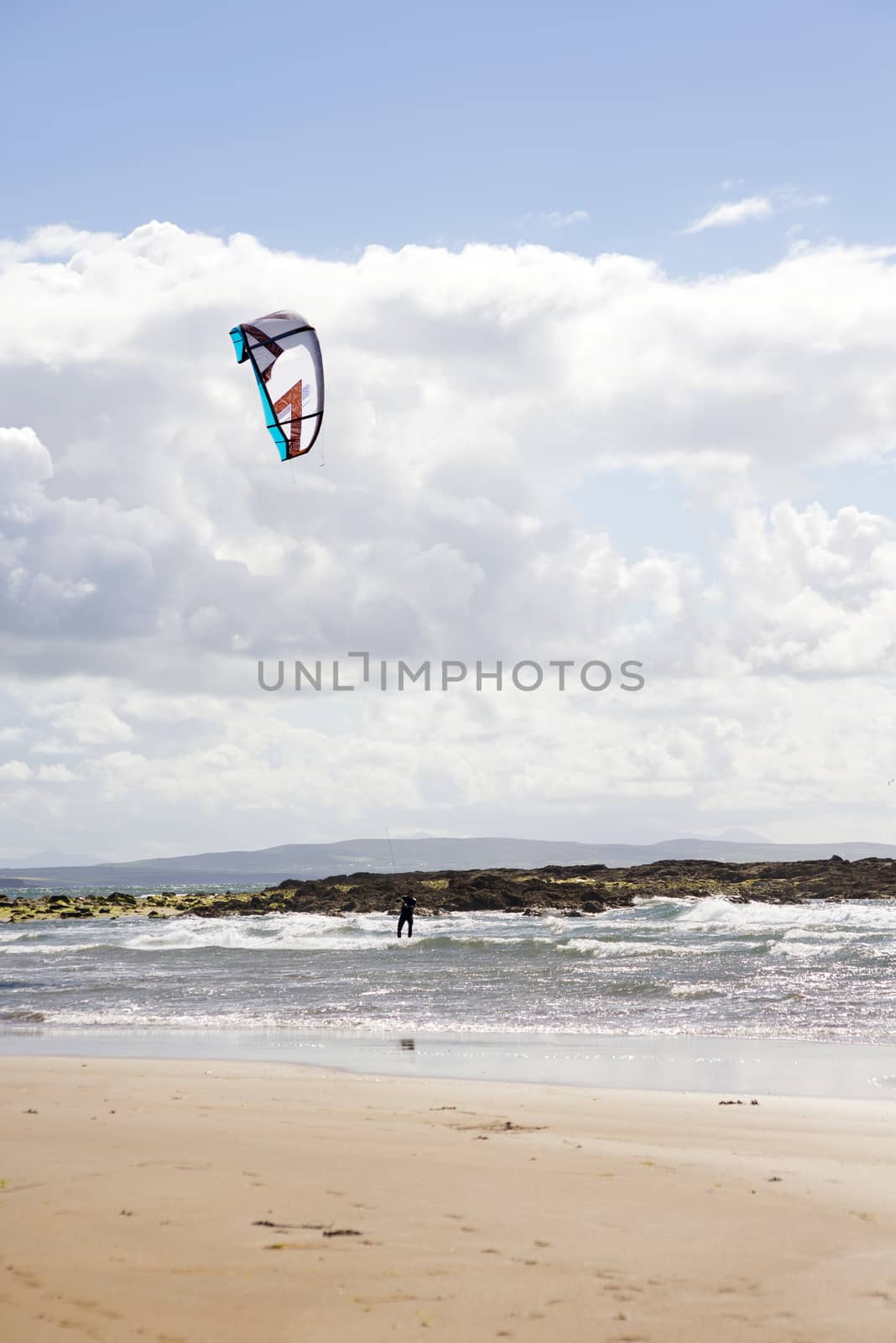 fast kite surfer on beautiful waves at beach in ballybunion county kerry ireland on the wild atlantic way