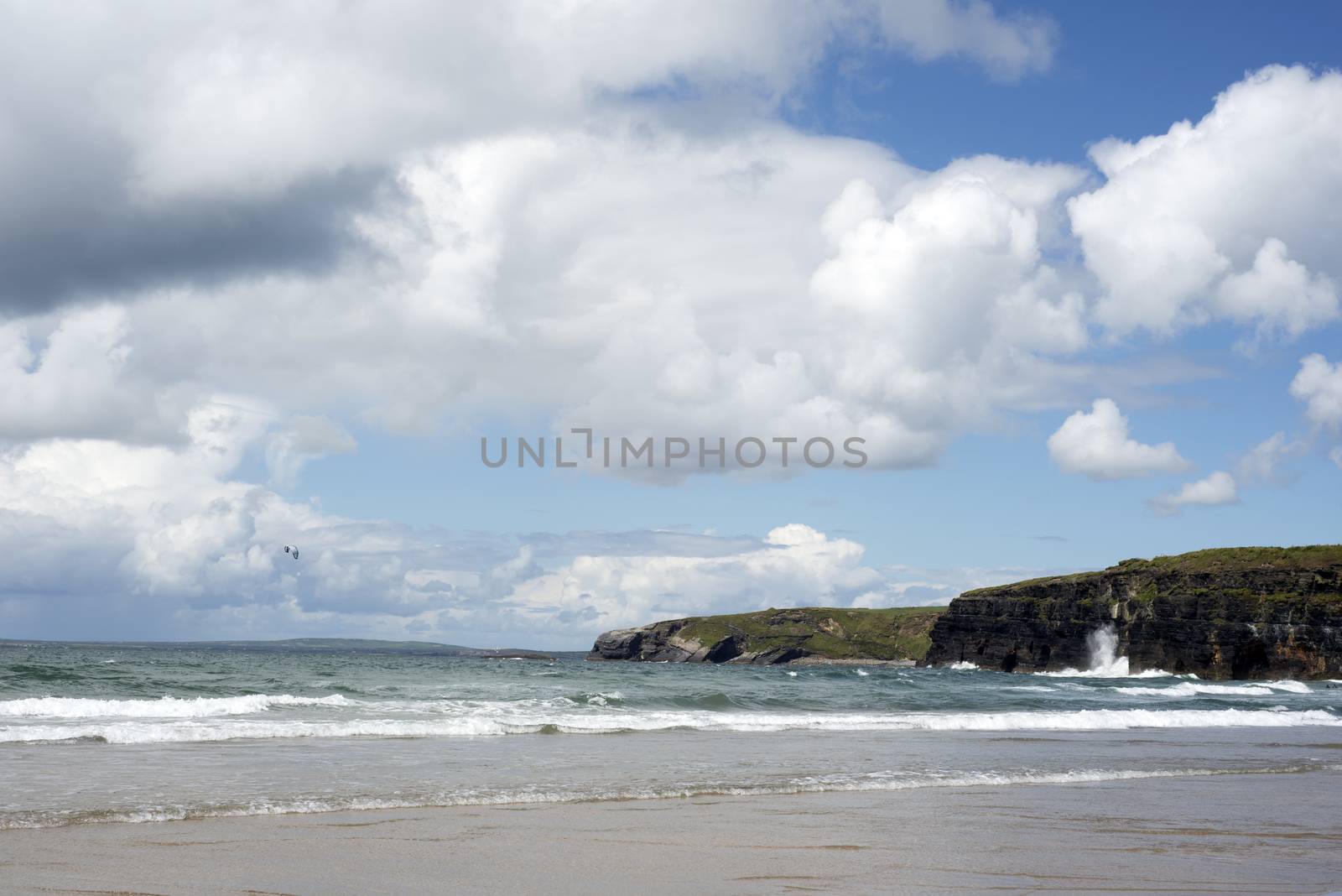 lone kite surfer surfing the waves by morrbyte