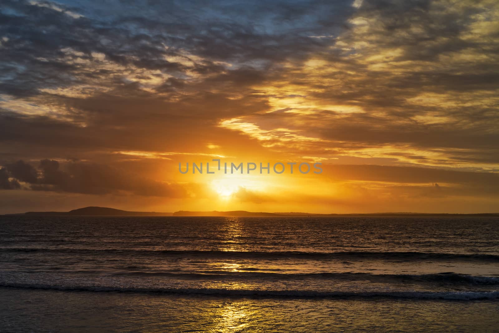 orangel sunset rays from beal beach by morrbyte