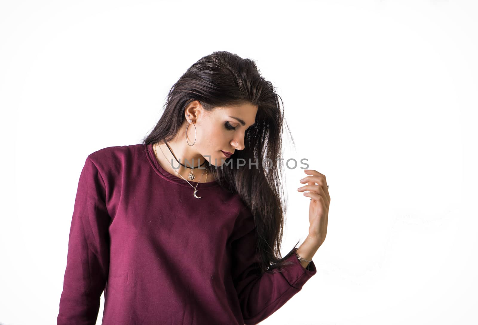 Beautiful female model, brunette. Isolated on white in studio shot