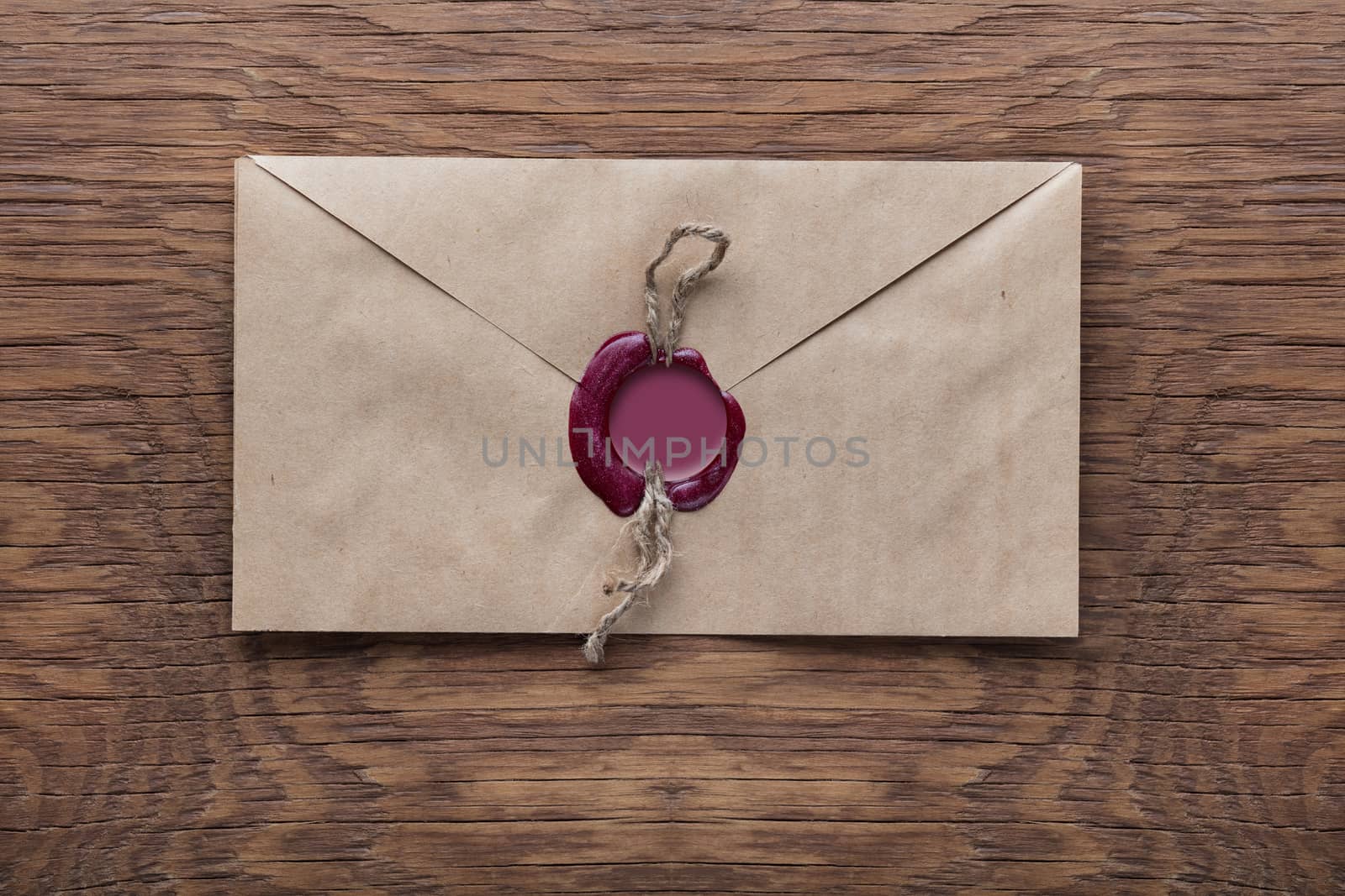 envelope with a stamp on the wooden background