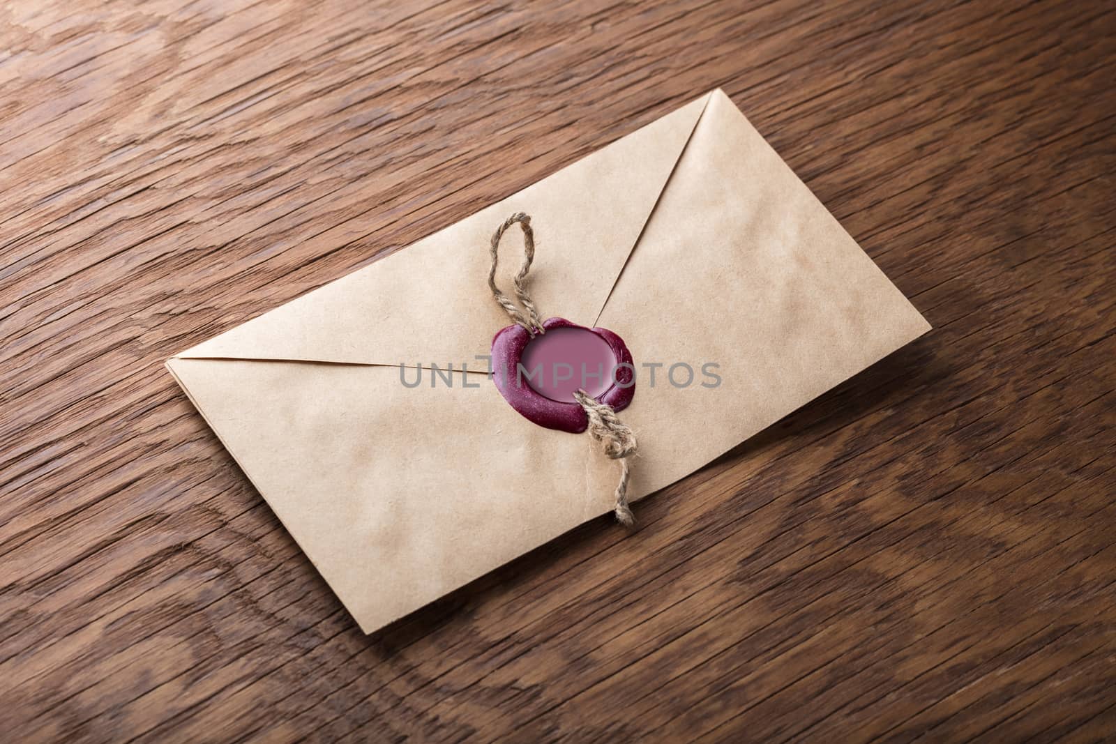 envelope with a stamp on the wooden background
