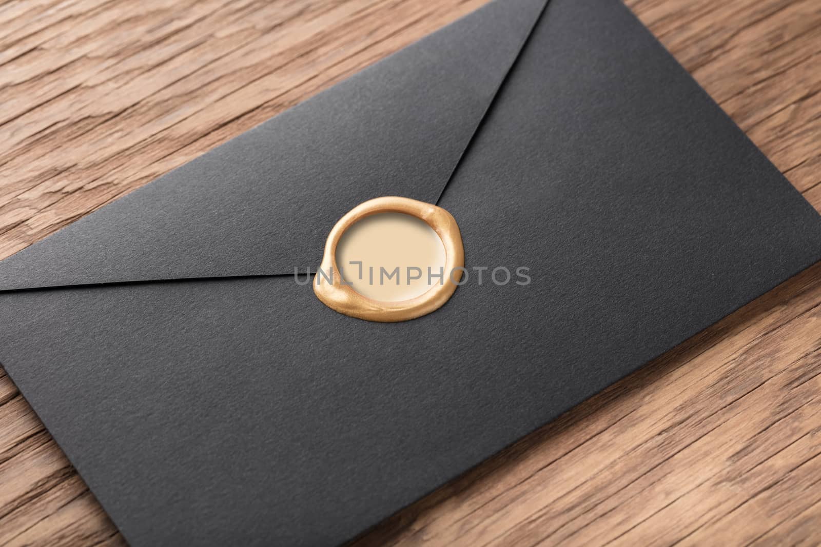 envelope with a stamp on the wooden background
