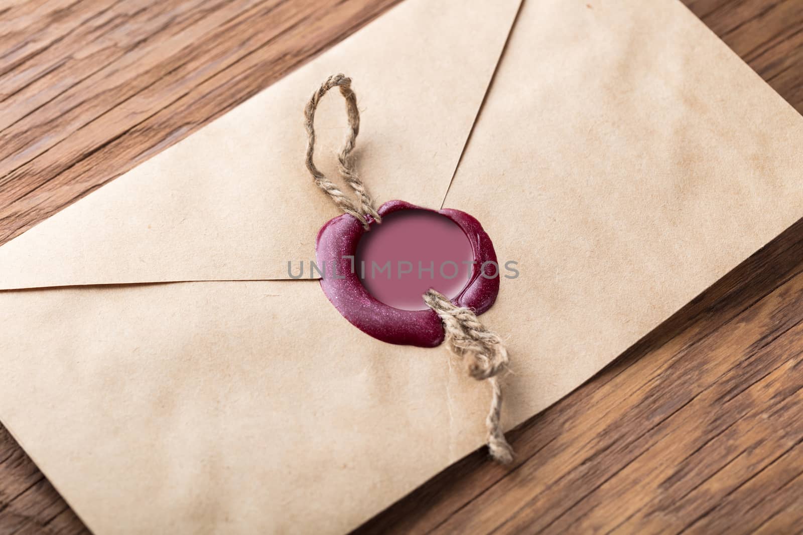 envelope with a stamp on the wooden background