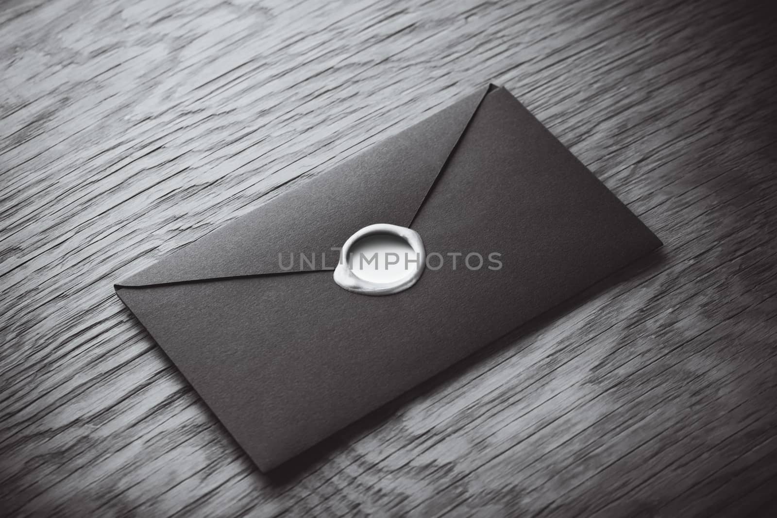 envelope with a stamp on the wooden background